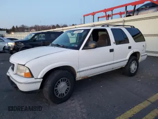 1998 GMC Jimmy SLS with VIN 1GKDT13W9W2506846, listed as a Copart auction lot 84854964 with 151,051 mi miles and Salvage Title. Bid and sale history available at carsss.com. Image 1.