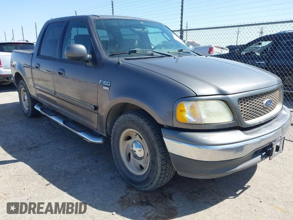 2003 Ford F-150 XLT with VIN 1FTRW07L63KA65904, listed as a IAAI auction lot 41983556 with 166,086 mi miles. Bid and sale history available at carsss.com. Image 1.