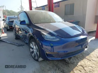 2022 Tesla Model Y Long Range z VIN 7SAYGAEE2NF364733, wystawiony jako IAAI lot #42290231 z przebiegiem 33 907 mil mil oraz . Historia ofert i sprzedaży dostępna na DreamBid. Obrazek 1.
