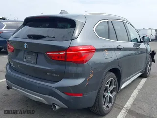 2019 BMW X1 xDrive28i with VIN WBXHT3C51K5L90571, listed as a IAAI auction lot 41909209 with 35,902 mi miles. Bid and sale history available at carsss.com. Image 4.