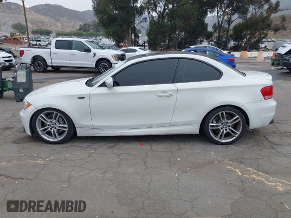 2013 BMW 1 Series 135i with VIN WBAUC9C54DVY60154, listed as a IAAI auction lot 42354743 with 159,571 mi miles and . Bid and sale history available at DreamBid. Image 14.