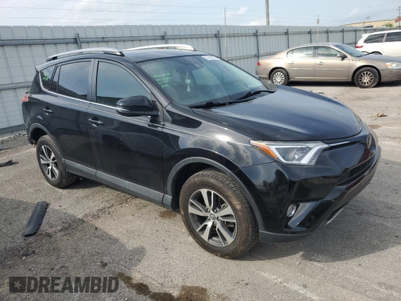 2018 Toyota RAV4 XLE with VIN 2T3WFREV3JW469307, listed as a Copart auction lot 57092295 with 47,639 mi miles and Salvage title. Bid and sale history available at DreamBid. Image 4.