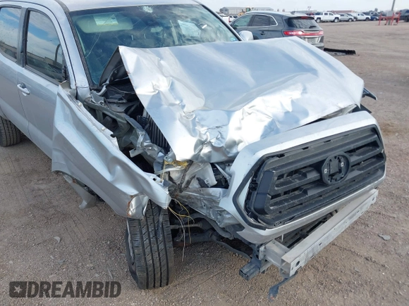 2022 Toyota Tacoma SR with VIN 3TYAX5GN8NT060017, listed as a IAAI auction lot 41504710 with 55,317 mi miles and . Bid and sale history available at DreamBid. Image 6.