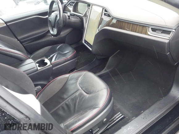 2013 Tesla Model S with VIN 5YJSA1CN0DFP20053, listed as a IAAI auction lot 41470660 with 61,568 mi miles and . Bid and sale history available at DreamBid. Image 5.