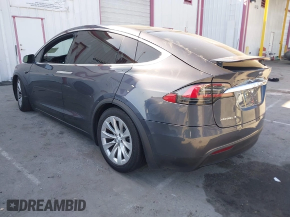 2018 Tesla Model X 75D with VIN 5YJXCDE28JF142509, listed as a IAAI auction lot 41993444 with 100,244 mi miles and . Bid and sale history available at carsss.com. Image 3.