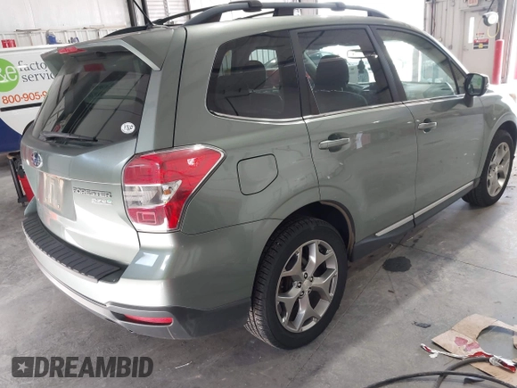 2015 Subaru Forester Touring with VIN JF2SJAUC5FH518262, listed as a IAAI auction lot 42789542 with 182,869 mi miles and . Bid and sale history available at DreamBid. Image 4.
