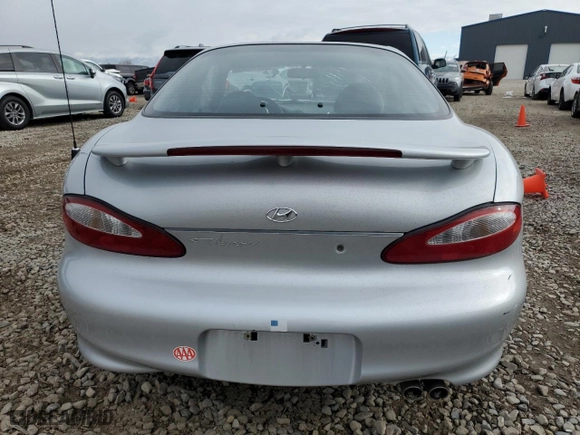 1999 Hyundai Tiburon with VIN KMHJG24F8XU126762, listed as a Copart auction lot 88747725 with 51,296 mi miles and Salvage Title. Bid and sale history available at carsss.com. Image 6.