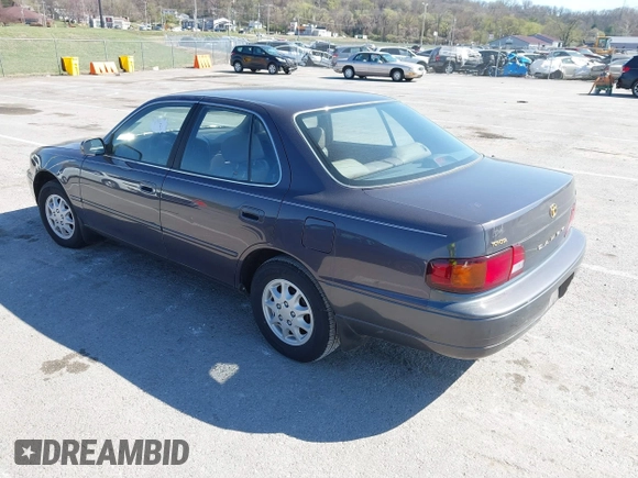 1996 Toyota Camry DX with VIN 4T1BG12K8TU915891, listed as a IAAI auction lot 41874731 with 57,564 mi miles. Bid and sale history available at carsss.com. Image 3.