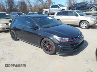 2021 Volkswagen Golf GTI S with VIN 3VW5T7AU6MM009986, listed as a IAAI auction lot 41744096 with 26,120 mi miles. Bid and sale history available at carsss.com. Image 1.
