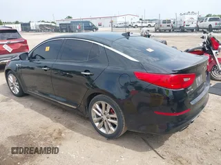 2014 Kia Optima SX Turbo with VIN 5XXGR4A65EG276131, listed as a IAAI auction lot 42429004 with 136,766 mi miles and . Bid and sale history available at DreamBid. Image 3.