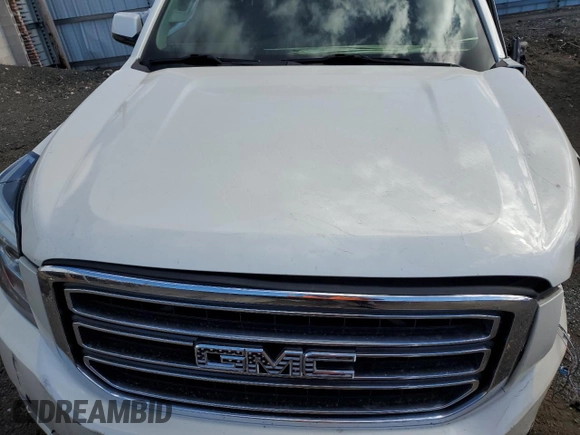 2015 GMC Yukon SLT with VIN 1GKS2BKC3FR143491, listed as a Copart auction lot 76062044 with Not Provided miles and Salvage Title. Bid and sale history available at DreamBid. Image 12.