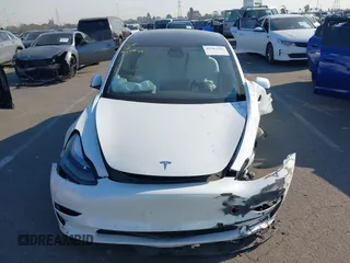 2022 Tesla Model 3 with VIN 5YJ3E1EA4NF319237, listed as a IAAI auction lot 41263761 with 44,384 mi miles and . Bid and sale history available at DreamBid. Image 12.