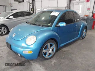 2004 Volkswagen Beetle Satellite Blue z VIN 3VWGK31C94M422268, wystawiony jako IAAI lot #42255431 z przebiegiem 127 672 mil mil oraz . Historia ofert i sprzedaży dostępna na DreamBid. Obrazek 2.