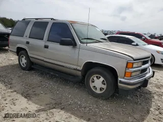 1999 Chevrolet Tahoe with VIN 1GNEC13RXXJ481481, listed as a Copart auction lot 50137645 with 233,418 mi miles and Salvage Title. Bid and sale history available at carsss.com. Image 4.