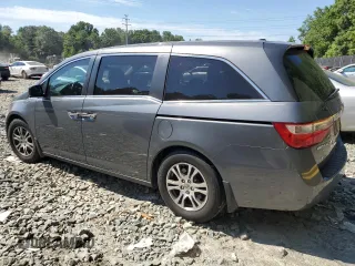 2012 Honda Odyssey EX-L with VIN 5FNRL5H69CB019771, listed as a Copart auction lot 59333624 with 197,203 mi miles and Salvage Title. Bid and sale history available at carsss.com. Image 2.