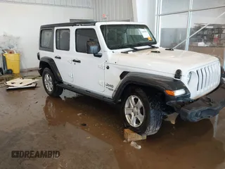 2019 Jeep Wrangler Unlimited Sport S z VIN 1C4HJXDG1KW577779, wystawiony jako IAAI lot #41289068 z przebiegiem 126 011 mil mil oraz . Historia ofert i sprzedaży dostępna na DreamBid. Obrazek 1.