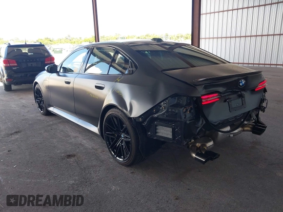 2025 BMW 5 Series with VIN WBS83FK04SCU11874, listed as a IAAI auction lot 42543784 with 4,517 mi miles and . Bid and sale history available at DreamBid. Image 3.