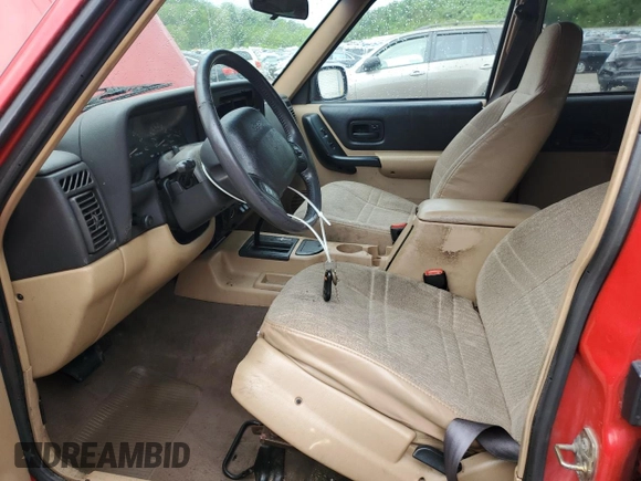2001 Jeep Cherokee Sport with VIN 1J4FT48S41L570480, listed as a Copart auction lot 56123925 with 216,338 mi miles and Salvage title. Bid and sale history available at DreamBid. Image 7.