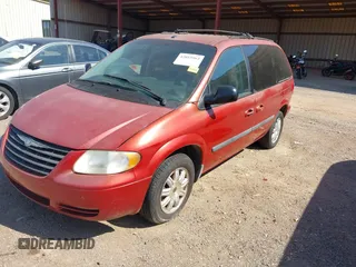 2006 Chrysler Town & Country SWB with VIN 1A4GP45R76B572053, listed as a IAAI auction lot 42015562 with 310,509 mi miles. Bid and sale history available at carsss.com. Image 2.