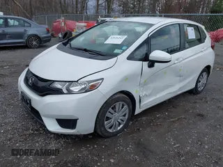 2017 Honda Fit LX with VIN JHMGK5H58HS021117, listed as a IAAI auction lot 42026243 with 94,953 mi miles. Bid and sale history available at carsss.com. Image 2.