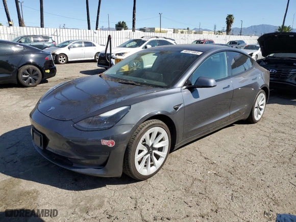 2022 Tesla Model 3 with VIN 5YJ3E1EA6NF143209, listed as a Copart auction lot 46321665 with 71,323 mi miles and Salvage Title. Bid and sale history available at carsss.com. Image 1.
