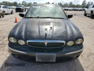 2003 Jaguar X-Type 2.5L Manual z VIN SAJEA51D73XD21289, wystawiony jako Copart lot #59583194 z przebiegiem 70 333 mil mil oraz Czysty tytuł • Clean title. Historia ofert i sprzedaży dostępna na DreamBid. Obrazek 5.