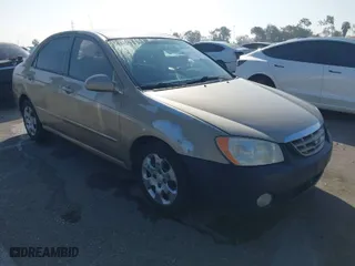 2004 Kia Spectra LX with VIN KNAFE122145013930, listed as a IAAI auction lot 41627031 with 93,565 mi miles. Bid and sale history available at carsss.com. Image 1.