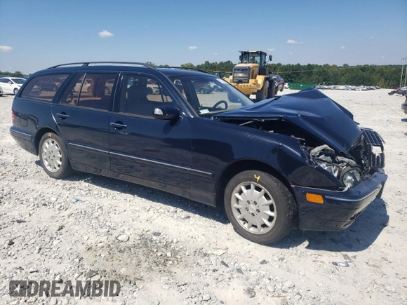 2001 Mercedes-Benz E-Class AWD with VIN WDBJH82J91X057063, listed as a Copart auction lot 70235274 with 174,846 mi miles and Salvage Title. Bid and sale history available at carsss.com. Image 4.