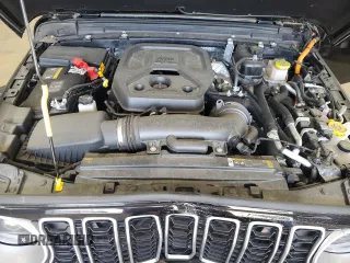 2024 Jeep Wrangler Sahara with VIN 1C4RJXP67RW292134, listed as a Copart auction lot 60993555 with 10,038 mi miles and Salvage title. Bid and sale history available at DreamBid. Image 12.