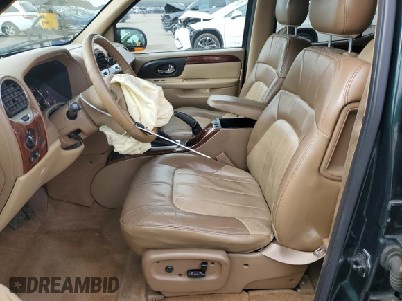 2003 GMC Envoy SLT z VIN 1GKET16P936191818, wystawiony jako Copart lot #53270645 z przebiegiem 130 357 mil mil oraz Szkody całkowita. Historia ofert i sprzedaży dostępna na DreamBid. Obrazek 7.