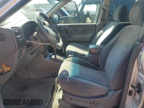2001 Isuzu Rodeo S with VIN 4S2CK58W914301037, listed as a Copart auction lot 72153074 with 230,781 mi miles and Clean Title. Bid and sale history available at DreamBid. Image 7.