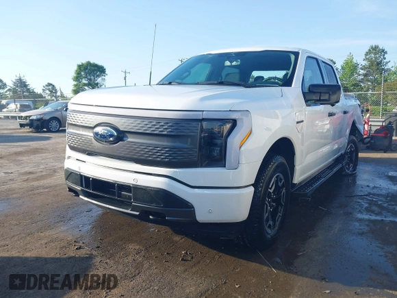 2023 Ford F-150 Lightning Pro with VIN 1FTVW1EL6PWG34059, listed as a IAAI auction lot 42010900 with 20,759 mi miles and . Bid and sale history available at DreamBid. Image 19.