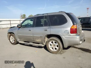 2003 GMC Envoy SLE with VIN 1GKDS13S332390989, listed as a Copart auction lot 74729104 with 127,680 mi miles and Salvage Title. Bid and sale history available at carsss.com. Image 2.