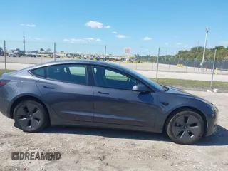 2023 Tesla Model 3 with VIN 5YJ3E1EA8PF626235, listed as a IAAI auction lot 42022893 with 30,333 mi miles and . Bid and sale history available at DreamBid. Image 14.