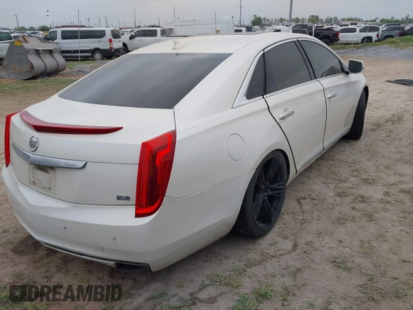 2013 Cadillac XTS Platinum z VIN 2G61U5S3XD9208737, wystawiony jako IAAI lot #41928451 z przebiegiem 167 984 mil mil oraz . Historia ofert i sprzedaży dostępna na DreamBid. Obrazek 4.