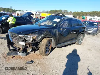 2018 Mazda CX-9 Grand Touring z VIN JM3TCADY5J0204845, wystawiony jako IAAI lot #41292695 z przebiegiem 98 751 mil mil oraz . Historia ofert i sprzedaży dostępna na DreamBid. Obrazek 2.