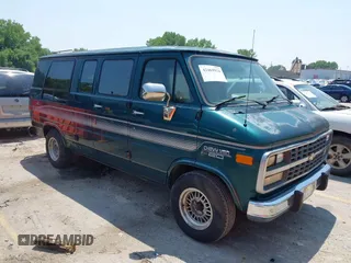 1995 Chevrolet Chevy Van z VIN 1GBEG25K5SF120517, wystawiony jako IAAI lot #42469924 z przebiegiem 99 761 mil mil oraz . Historia ofert i sprzedaży dostępna na DreamBid. Obrazek 1.