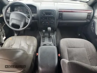 2000 Jeep Grand Cherokee Laredo with VIN 1J4GW48S9YC390448, listed as a Copart auction lot 56985265 with Not provided miles and Salvage title. Bid and sale history available at DreamBid. Image 8.