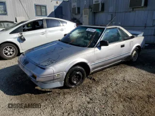 1989 Toyota MR2 z VIN JT2AW15C0K0146356, wystawiony jako Copart lot #76256644 z przebiegiem 294 380 mil mil oraz Tytuł czysty. Historia ofert i sprzedaży dostępna na DreamBid. Obrazek 1.