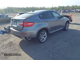 2014 BMW X6 xDrive35i z VIN 5UXFG2C57E0H10305, wystawiony jako IAAI lot #42109416 z przebiegiem 144 816 mil mil oraz . Historia ofert i sprzedaży dostępna na DreamBid. Obrazek 4.
