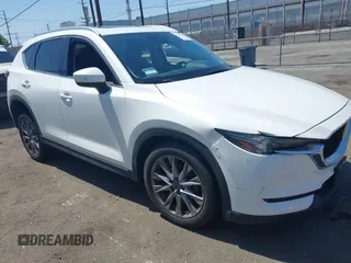 2020 Mazda CX-5 Grand Touring with VIN JM3KFADM9L0821930, listed as a IAAI auction lot 42549986 with 29,929 mi miles and . Bid and sale history available at DreamBid. Image 6.