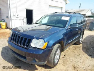 2010 Jeep Grand Cherokee Laredo with VIN 1J4PS4GK0AC112654, listed as a IAAI auction lot 41809445 with 418,301 mi miles. Bid and sale history available at carsss.com. Image 2.