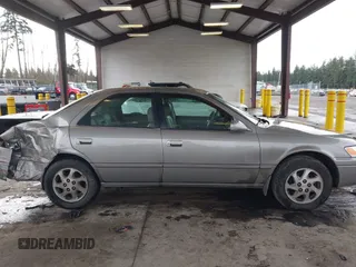 1998 Toyota Camry LE z VIN JT2BF28K1W0109514, wystawiony jako IAAI lot #41610102 z przebiegiem 161 266 mil mil oraz . Historia ofert i sprzedaży dostępna na DreamBid. Obrazek 13.