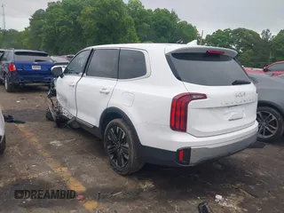 2024 Kia Telluride LX z VIN 5XYP24GC1RG411138, wystawiony jako IAAI lot #42144580 z przebiegiem Nie podano mil oraz . Historia ofert i sprzedaży dostępna na DreamBid. Obrazek 3.