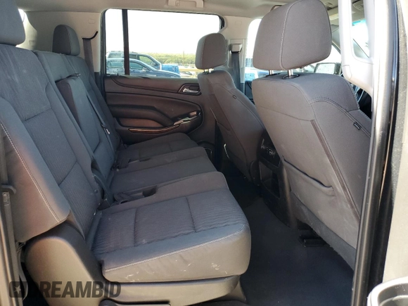 2019 Chevrolet Suburban LS with VIN 1GNSCGKC6KR180042, listed as a Copart auction lot 76829394 with 75,574 mi miles and Salvage title. Bid and sale history available at DreamBid. Image 11.