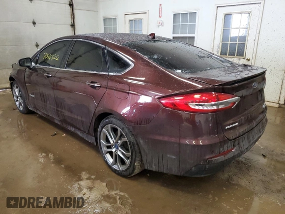 2019 Ford Fusion Hybrid Titanium with VIN 3FA6P0RU2KR211799, listed as a Copart auction lot 70843212 with 54,157 mi miles. Bid and sale history available at carsss.com. Image 2.