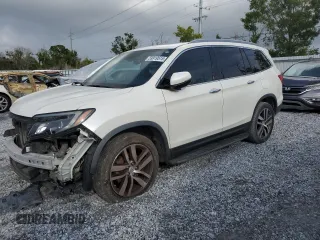 2017 Honda Pilot Elite with VIN 5FNYF6H05HB042184, listed as a Copart auction lot 59919515 with 164,127 mi miles and Salvage title. Bid and sale history available at DreamBid. Image 1.