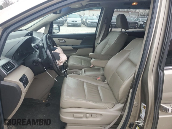 2012 Honda Odyssey Touring with VIN 5FNRL5H9XCB078399, listed as a Copart auction lot 52360165 with 174,819 mi miles and Salvage Title. Bid and sale history available at DreamBid. Image 7.