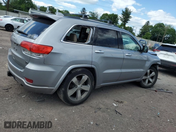 2015 Jeep Grand Cherokee Overland with VIN 1C4RJFCG3FC880084, listed as a Copart auction lot 57291165 with 112,442 mi miles and Salvage title. Bid and sale history available at DreamBid. Image 3.