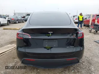 2023 Tesla Model Y Long Range z VIN 7SAYGDEEXPA181114, wystawiony jako IAAI lot #41564617 z przebiegiem 64 990 mil mil oraz . Historia ofert i sprzedaży dostępna na DreamBid. Obrazek 17.